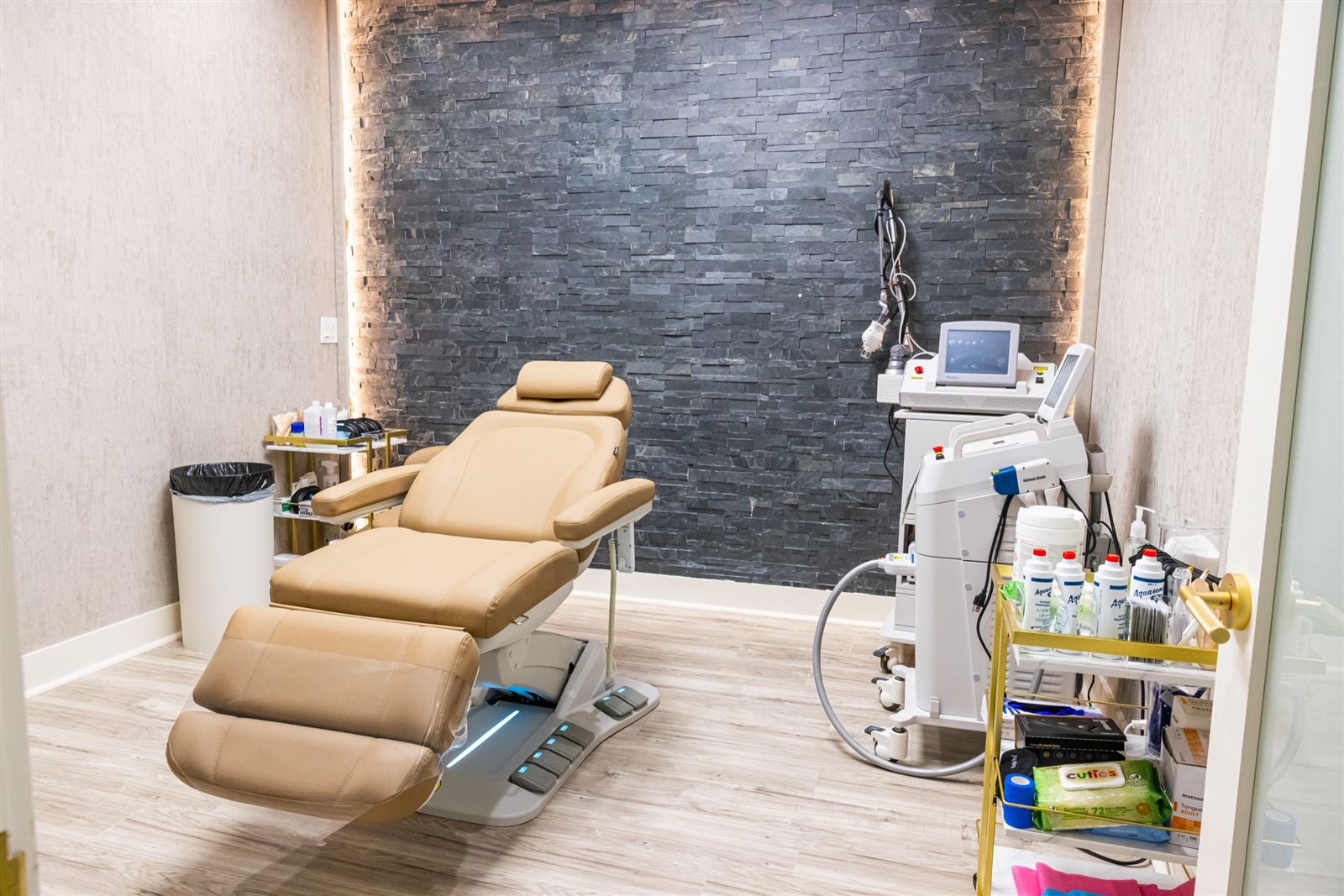 Aesthetic treatment room with a stone feature wall
