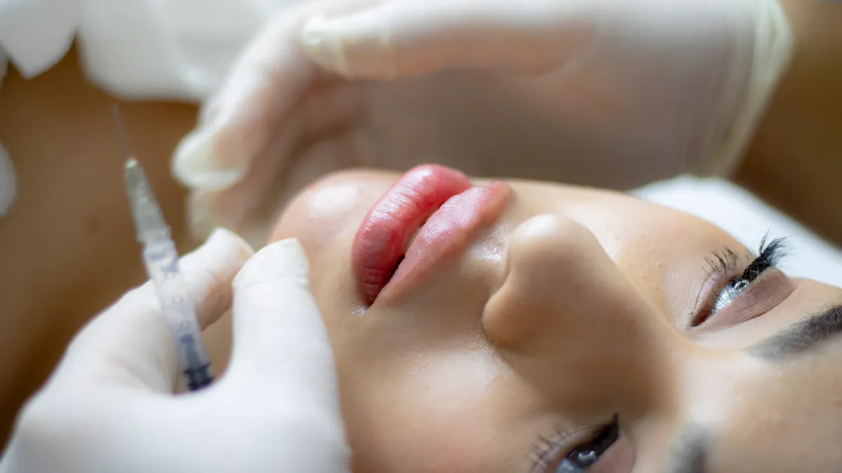 A licensed provider performing a dermal filler treatment