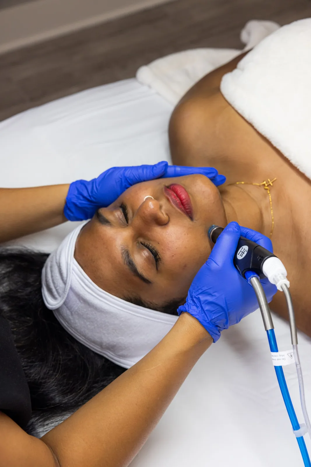 A client relaxing during a HydraFacial at EVO in Tampa